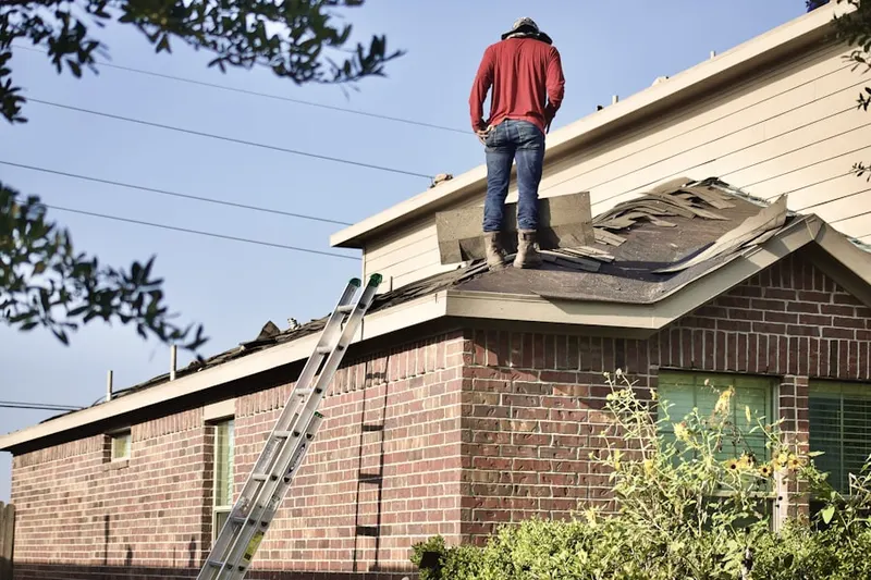 Professional roofer working on a residential roof in Pinebrook Estates